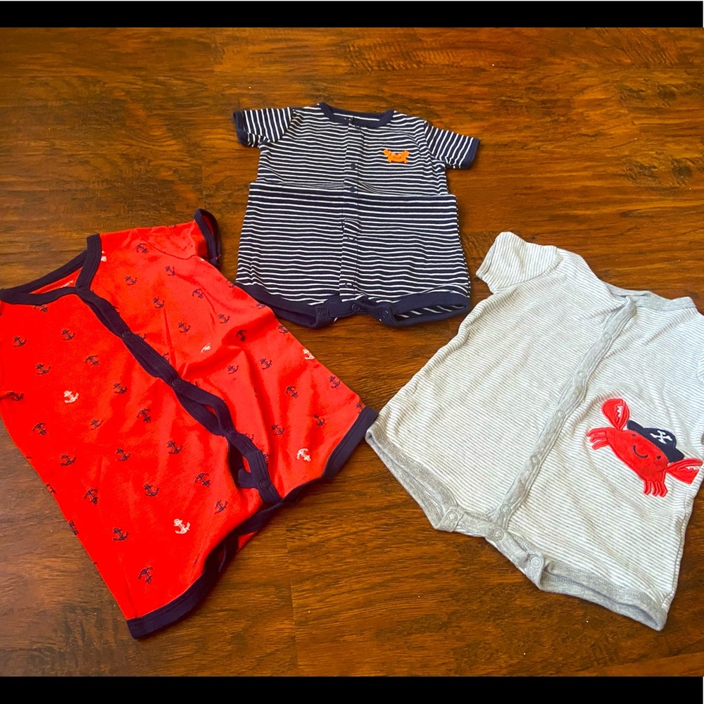 3 baby boys Carters one-piece outfits: size 6mo, 9mo, and 12mo.